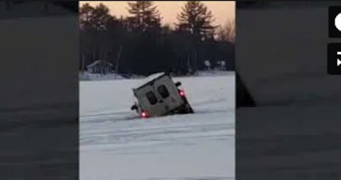 Truck Moving Over Frozen Lake Breaks and Falls Through Ice into Water
