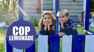 Lad desperate to be a police officer set up a stall serving lemonade and donuts to cops