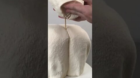 Hyperrealistic Cake on a Bed?