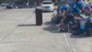 People praying over TPD patrol car at Mingo Valley Division