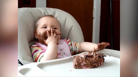 A Baby Girl Eats A Chocolate Cake And Rubs The Frosting Into Her Eyes