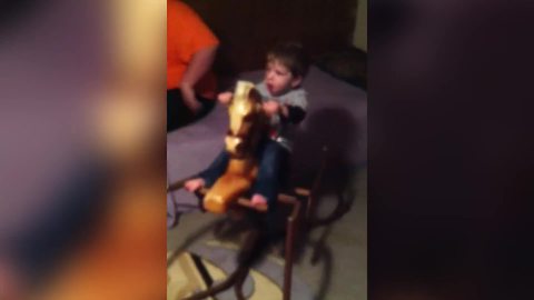 Funny Toy Boy Nearly Falls Off A Rocking Horse