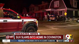 SUV slams into Covington home