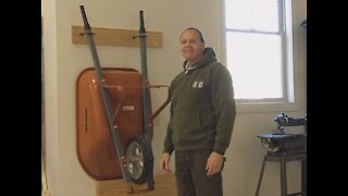 Wheelbarrow on Garage Wall