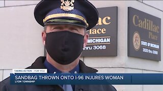 Sandbag thrown onto I-96 injures women