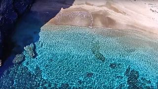 Drone reveals the secret lover's cove in Cavo D'Oro, Greece