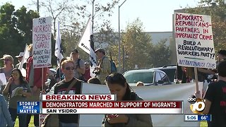 Demonstrators march in support of migrants