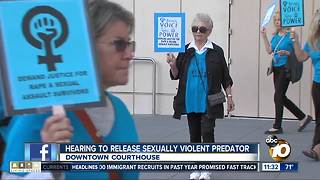 Community members gather to protest rapist's release