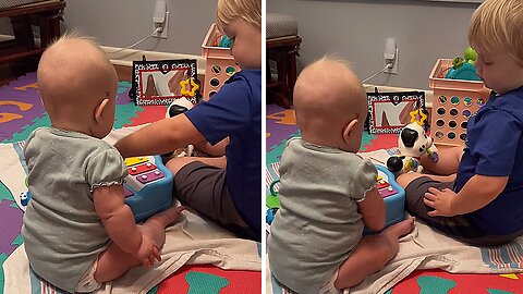 Toddler Shows Baby Sister How to Play Piano