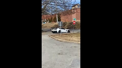 White Corvette makes noise in the neighborhood