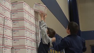Students at the Ambrose School prepares care packages for the troops