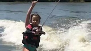 Young girl dances while wakeboarding!