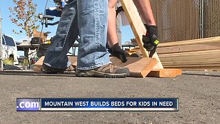 Bankers build bunk beds for kids in need