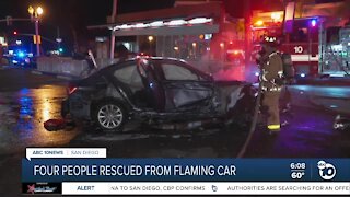 4 people rescued after car bursts into flames