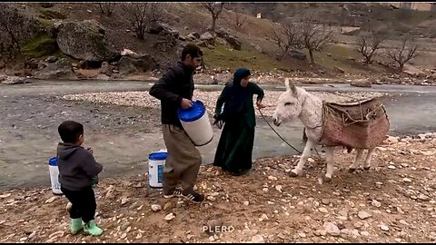 Life in the Nomads : Bringing water from the river by the nomadic woman