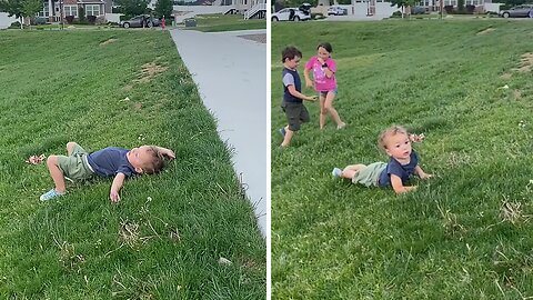 Toddler can't figure out how to roll down hill