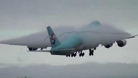 Incredible amount of condensation forms around airplane on takeoff