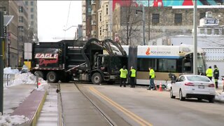 Garbage truck derails streetcar; Hop service suspended