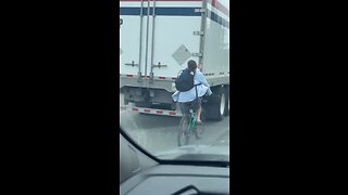 Cyclist Riding On Highway