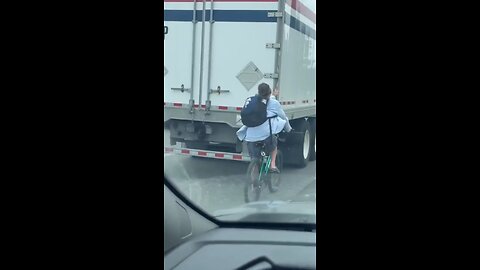 Cyclist Riding On Highway