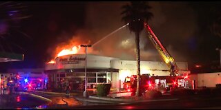 Las Vegas firefighters battle fire at mini-mart on Monday