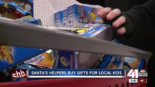 Santa's helpers buy gifts for local kids