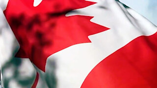 Canadian flag close up slow motion blue sky
