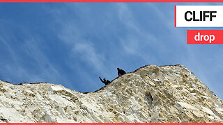 Pair snapped sitting on the edge of notoriously dangerous 500-foot cliff