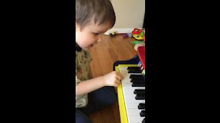 Zane playing his piano