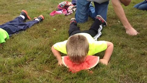 Young Boy Competes In A Watermelon Eating And Totally Smashes It!