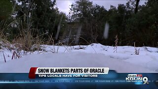 Snow blankets parts of Oracle