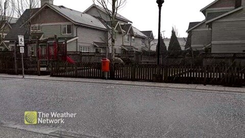 A downpour of hail pelts a suburban road in Maple Ridge, B.C.