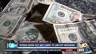 Woman giving out gift cards to laid-off neighbors