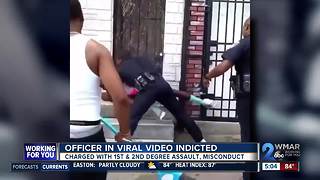 Baltimore officer seen in viral punching video charged