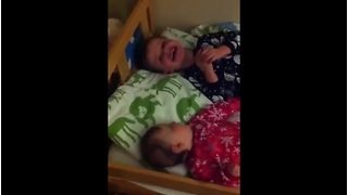Little boy sends baby brother into laughing fit