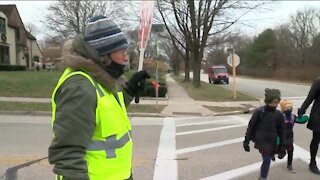 'They are almost like my own': Local crossing guard beloved by the community