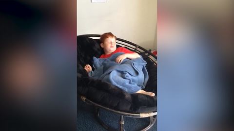 Young Boy Falls Off A Chair While Sleeping