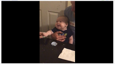 Infant laughs out loud for the first time