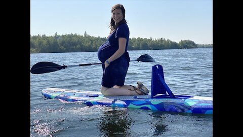 Pregnant Mom about to Pop while paddle boarding