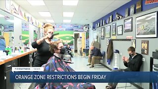 Customers get in haircuts and dining before orange zone restrictions take effect