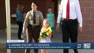 Law enforcement and veterans escort child to school who lost father