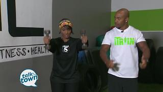 Fitness Trainer Gerell Webb shows exercises to work arms and shoulders