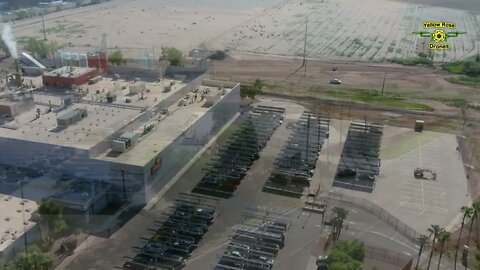 Drone Flight Past A Frito Lay Plant And Their Solar Panel Farm in Casa Grande AZ
