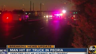 Man dies after being hit by car in Peoria