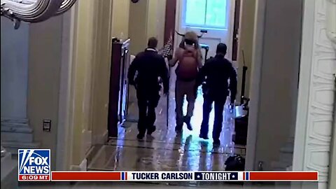 Must-See: Tucker Carlson Unveils Exclusive Footage of 'QAnon Shaman' in Capitol on Jan. 6th, Sending Shockwaves Through Social Media!"