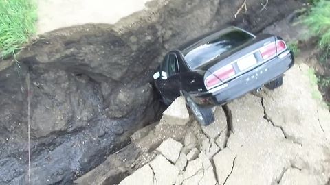 Car falls into crevasse after heavy rains in Renville County
