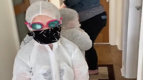 Mother Makes Children Wear Fullbody Protective Gear To Hug Grandparents