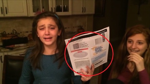 Surprise tickets send this girl into tearful hysterics. What could they be?