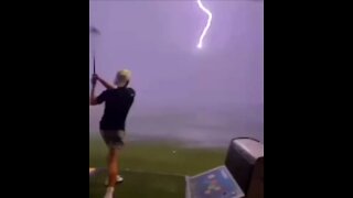 Lightening Strikes A Golf Ball Feet From Golfer