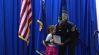 Local girl honored for helping officers